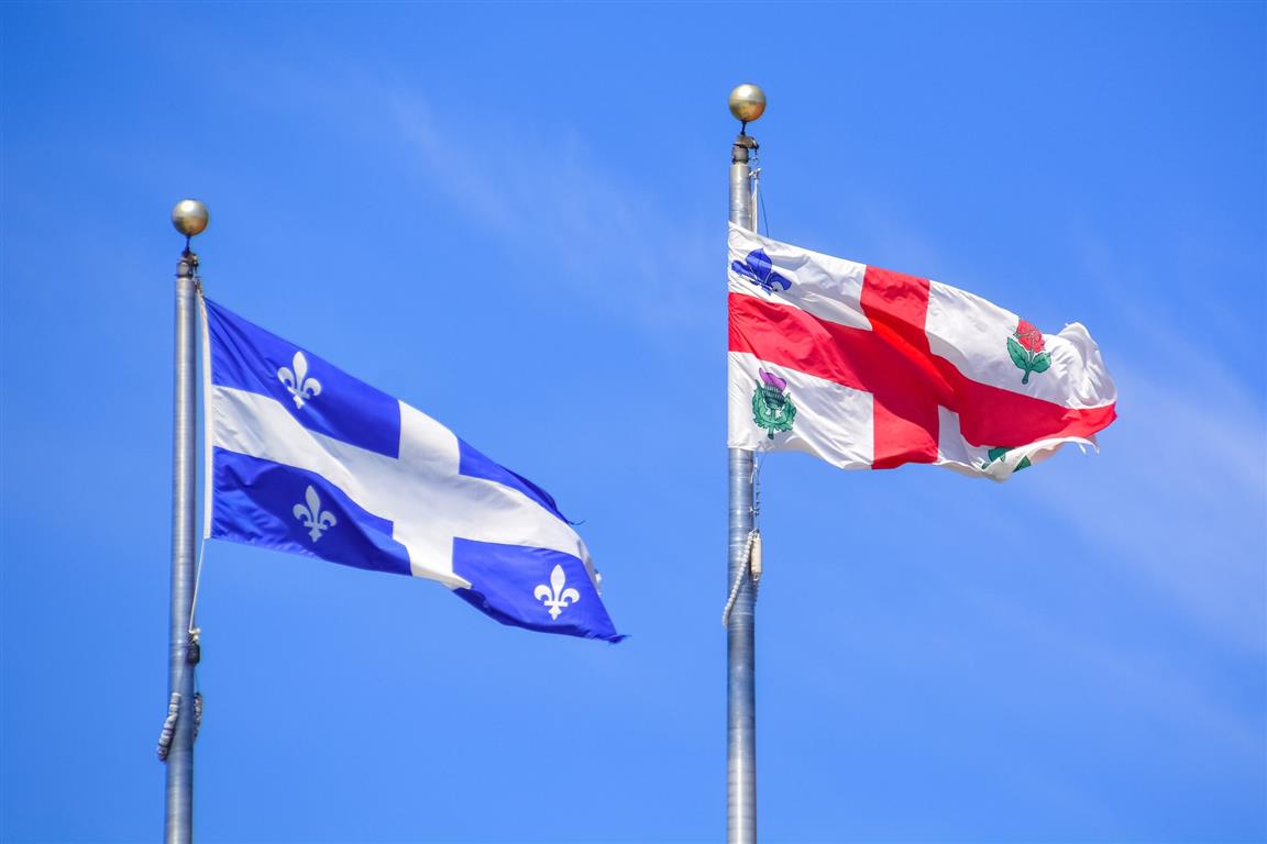Flags Quebec, Montreal - Photo by Jeremy Bezanger on Unsplash