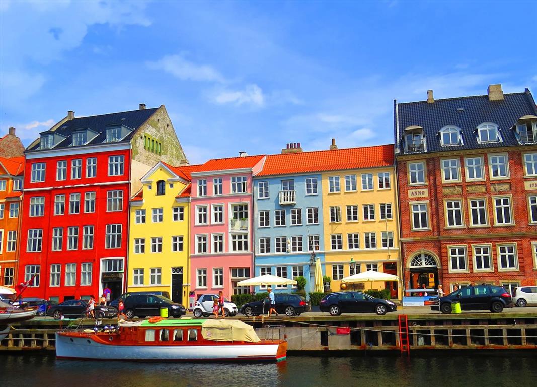 A dock with colorful houses in Copenhagen - Source: Photo by Meg Jerrard on Unsplash