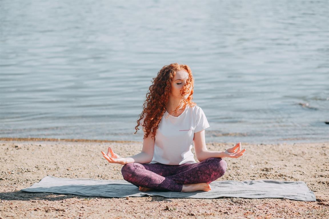 Woman Doing Yoga Exercise At The Sea Shore - Credit: Natalie on Pexels